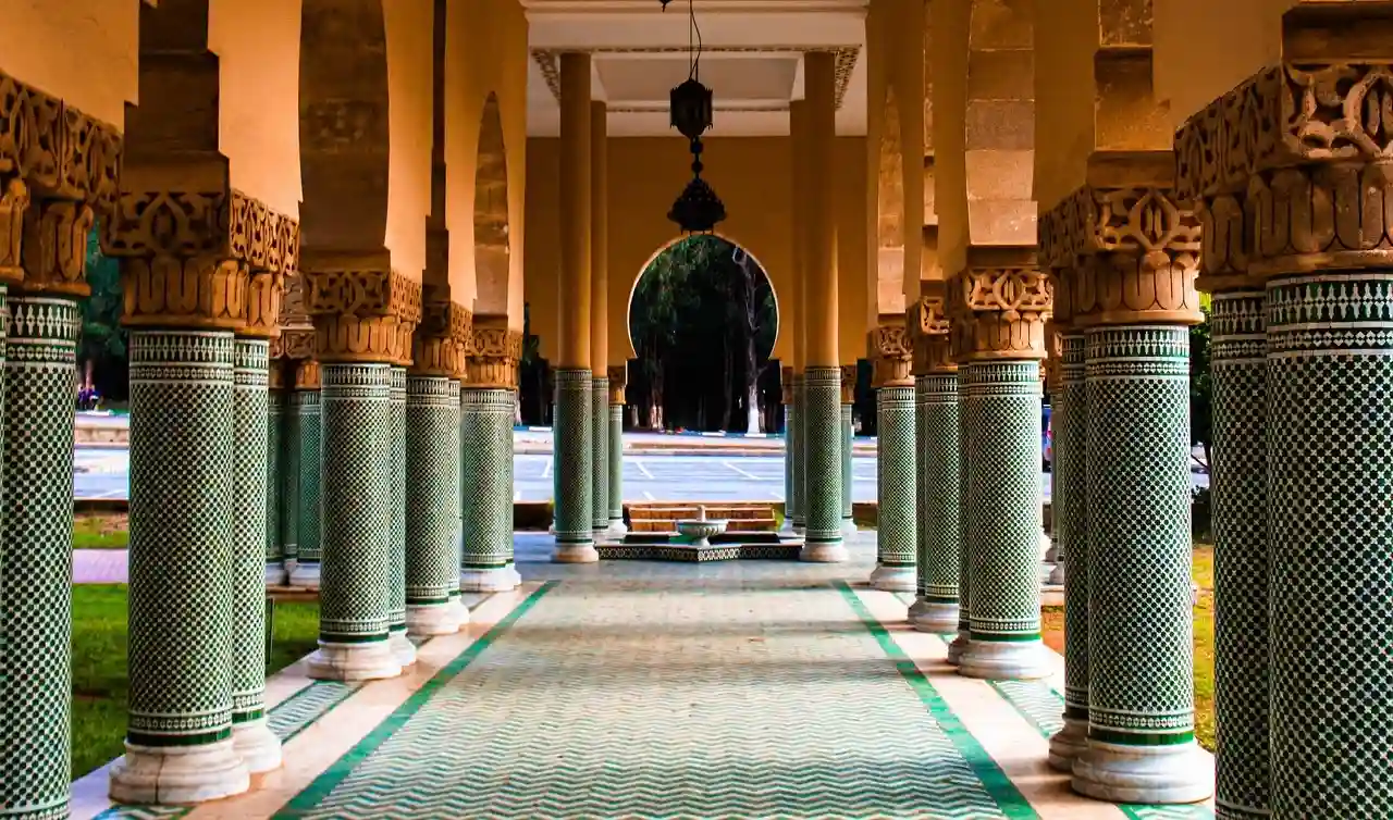 Intricate Moroccan Zellige tiles decorating a mosque interior